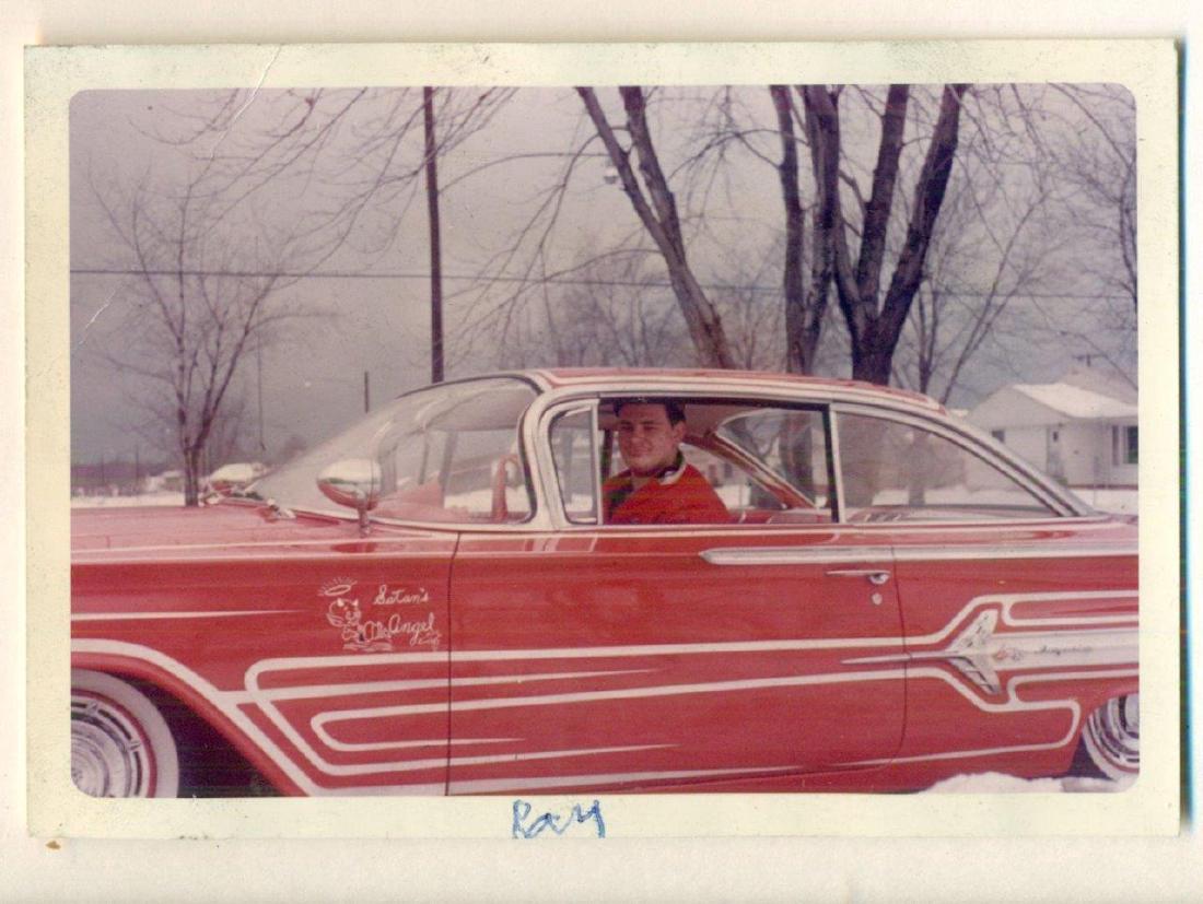 1960 Vintage Snapshot Chevrolet Chevy Impala: Circa 1960 Vintage Snapshot; Young man in red Chevrolet Impala, red with fancy white pin-striping and graphic, "Satan's Angel". ID on border in ink, "Ray". Exterior dimensions are approximately: 5" x