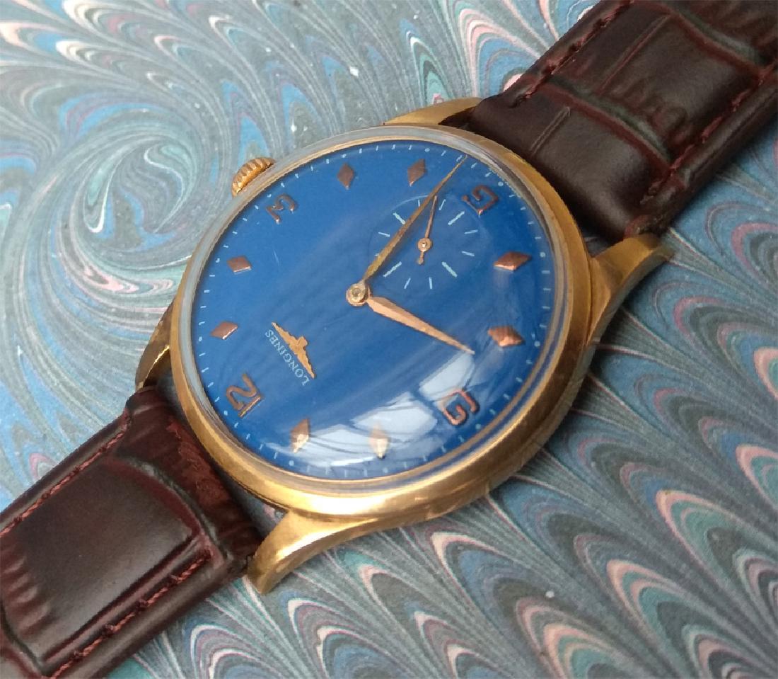 Vintage Longines 18K Solid Gold Blue Dial Manual Watch: Men's vintage original LONGINES wrist watch 18K Solid Gold in very good condition and working perfectly. This is a Swiss antique watch with original Dial repainted in blue. Case size is 37.1mm (withou