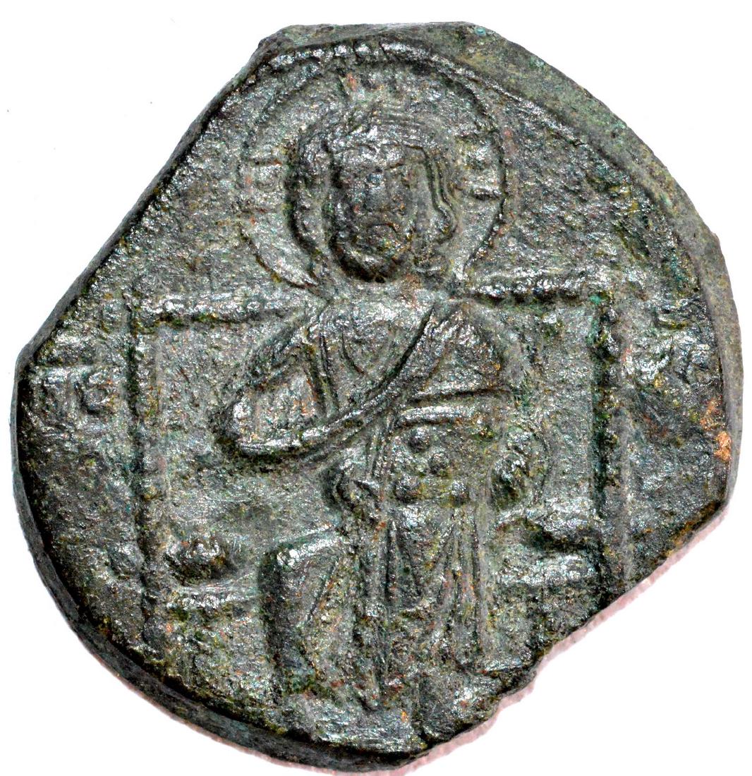 Byzantine Anonymous Folis - Jesus Christ: Date: ca. 12th C AD Materials: Copper Dimensions: 20mm; 12 grams Provenance/Additional Information: From an old British collection, property of a London collector, acquired on British and European art
