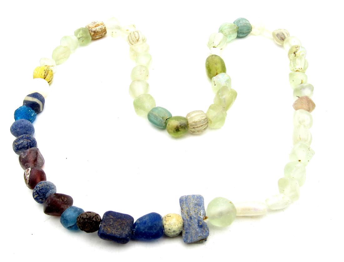 Rare Viking Colored Glass Necklace: Item: Rare Viking Colored Glass Necklace Date: ca 900 AD Material: Glass / Stone Dimensions: 490mm - 45.2grams - 57beads Provenance/Additional Information: Purchased from an old British collection, pr