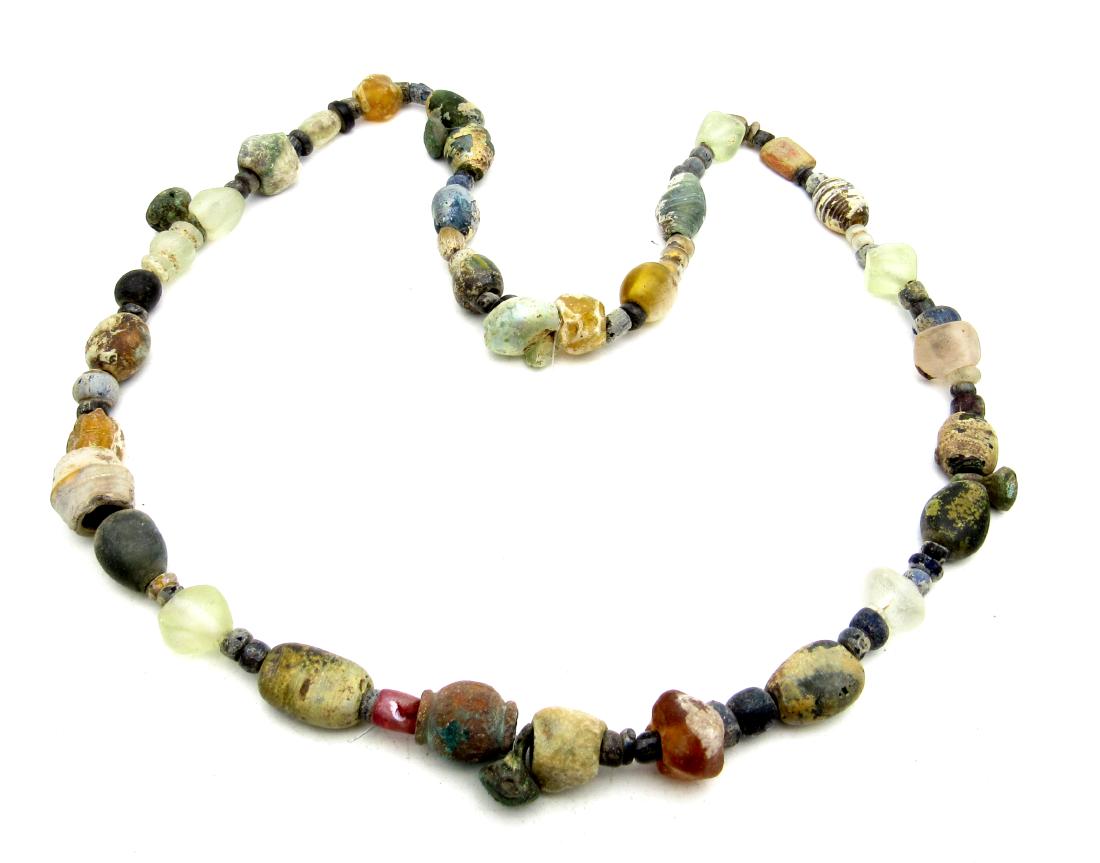 Rare Viking Colored Glass Beaded Necklace: Item: Rare Viking Colored Glass Beaded Necklace Date: ca. 900 AD Material: Glass / Stone / Bronze Dimensions: 500mm - 41.3grams - 83beads 4bronze Provenance/Additional Information: Purchased from an o