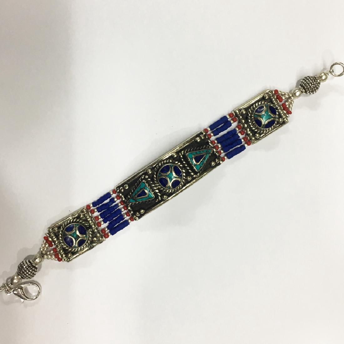 Tibetan Silver Turquoise & Coral Handmade Bracelet: Item: Beads Handmade Gemstone choker Bracelet Origin: Tibetan Handmade Stones: Turquoise & Coral Size (inches): 6-7 Please note that this lot has a confidential reserve. When you leave a bid in advanc