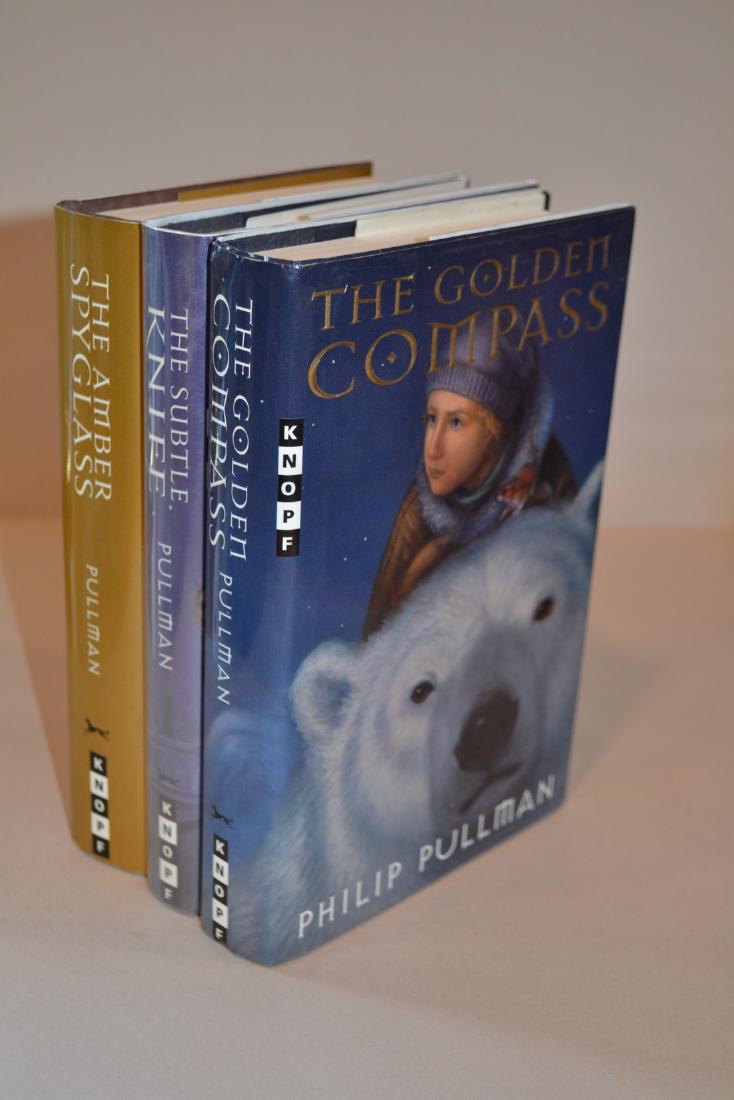 His Dark Materials (trilogy in 3 volumes): His Dark Materials (trilogy in 3 volumes) Pullman, Philip NY: Knopf, 1996- 2000. First Edition 3 volumes, The Golden Compass, The Subtle Knife & The Amber Spyglass. Please note that this lot has a con