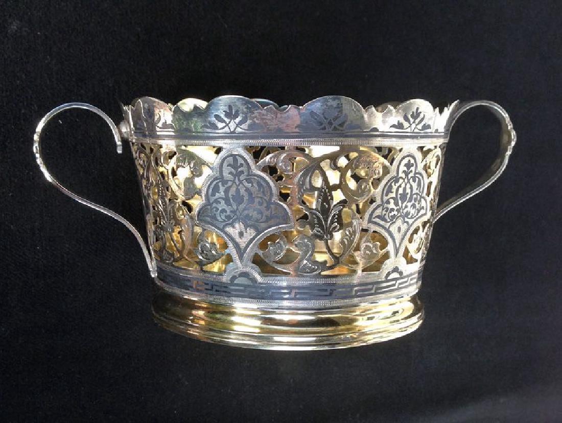 Mid-Century Russian 875 Gilt Silver Niello Wine Coaster: A decorative silver bottle stand or wine coaster, parcel gilt, engraved and niello decorated. Made in Russia around 1950 in the Imperial style of the late 19th century. Outer rim with Russian hammer &