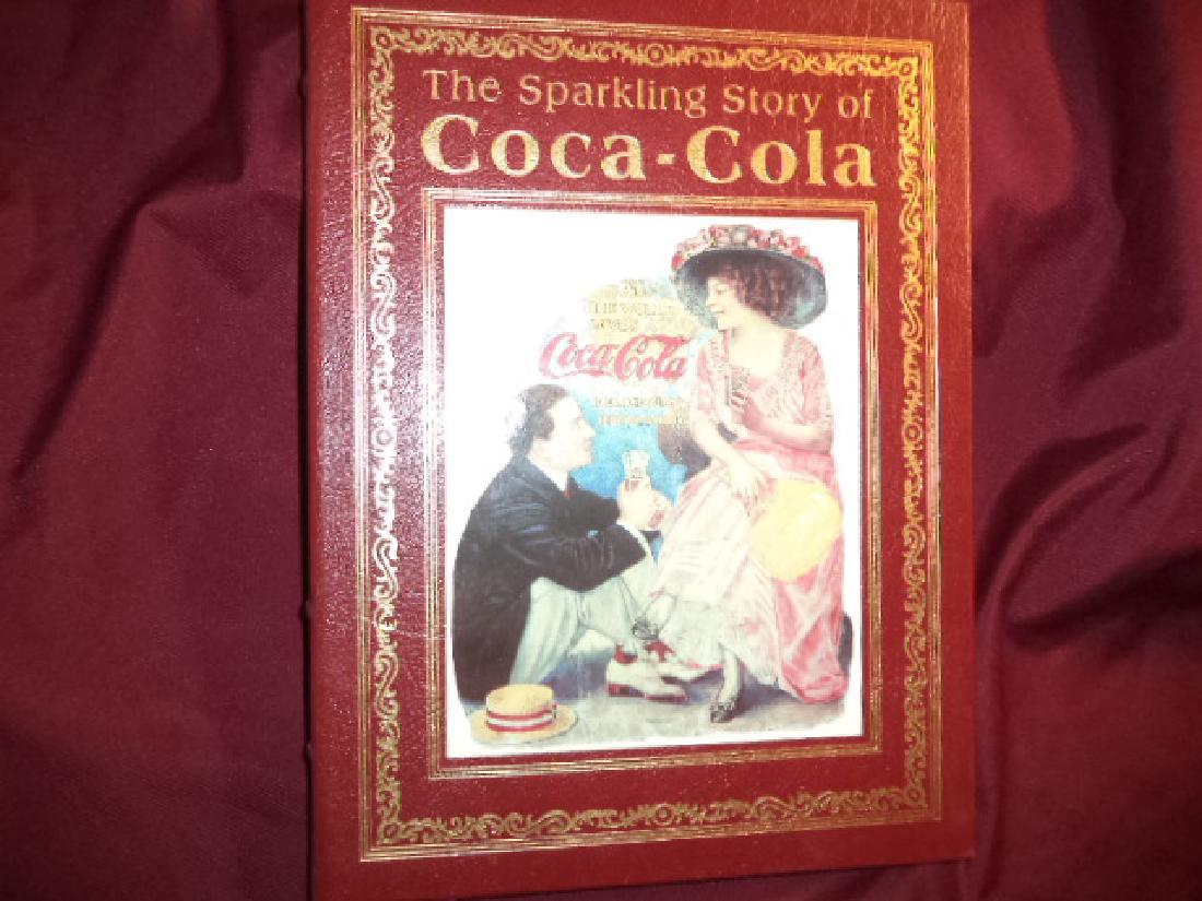 The Sparkling Story of Coca-Cola Entertaining History: The Sparkling Story of Coca-Cola. An Entertaining History Including Collectibles, Coke Lore, and Calendar Girls. Young-Witzel, Gyvel. Easton Press. First edition. 4to. Illustrated in black, white and