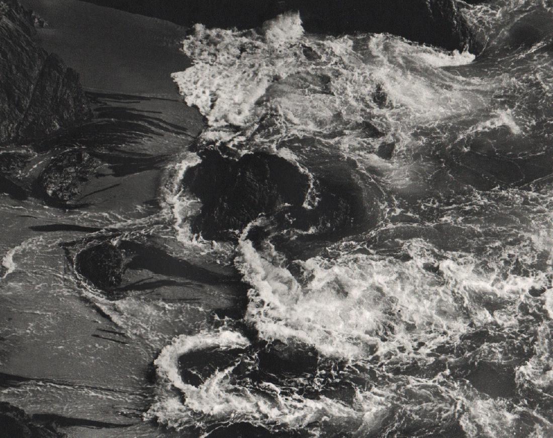 EDWARD WESTON - Point Lobos Surf, China Cove: Artist: EDWARD WESTON Print Title: Point Lobos Surf, China Cove Medium: Unmounted Sheet-fed Gravure Printed in the USA Printing Date: Early 1970s Image Size: 9" x 7" Edward Henry Weston was a 20th-cen