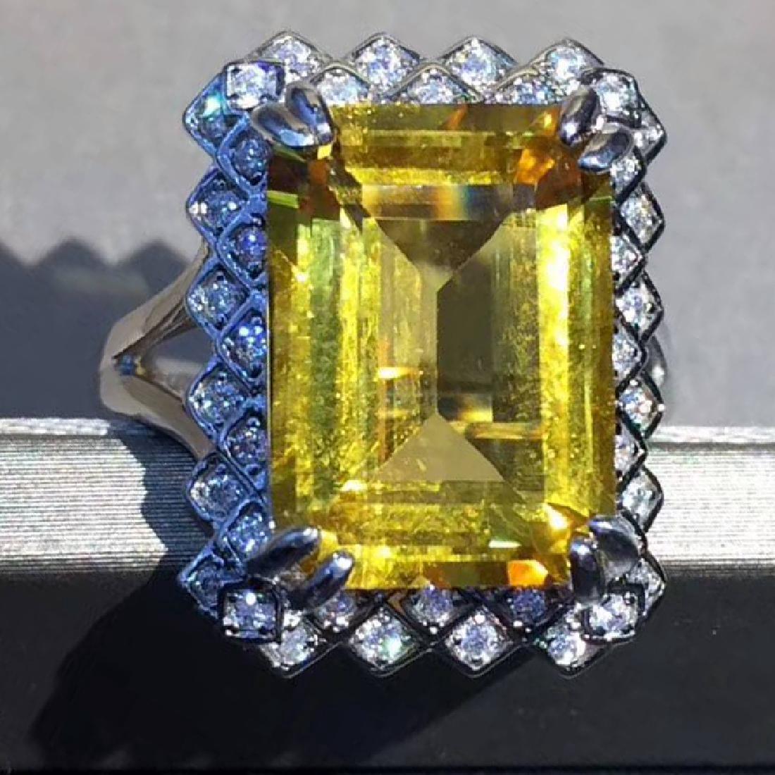 Sterling Silver Citrine Zircon Ring, 5.5ct: Main Stone: Citrine Main Stone Size:10*14mm Color: Yellow Carat Total Weight:5.5ct Cut: Very Good Secondary Stone: Zircon Color Grade: J - I Clarity: SI1 - SI2 Ring Size: 6.75 (can be resized) Shippin