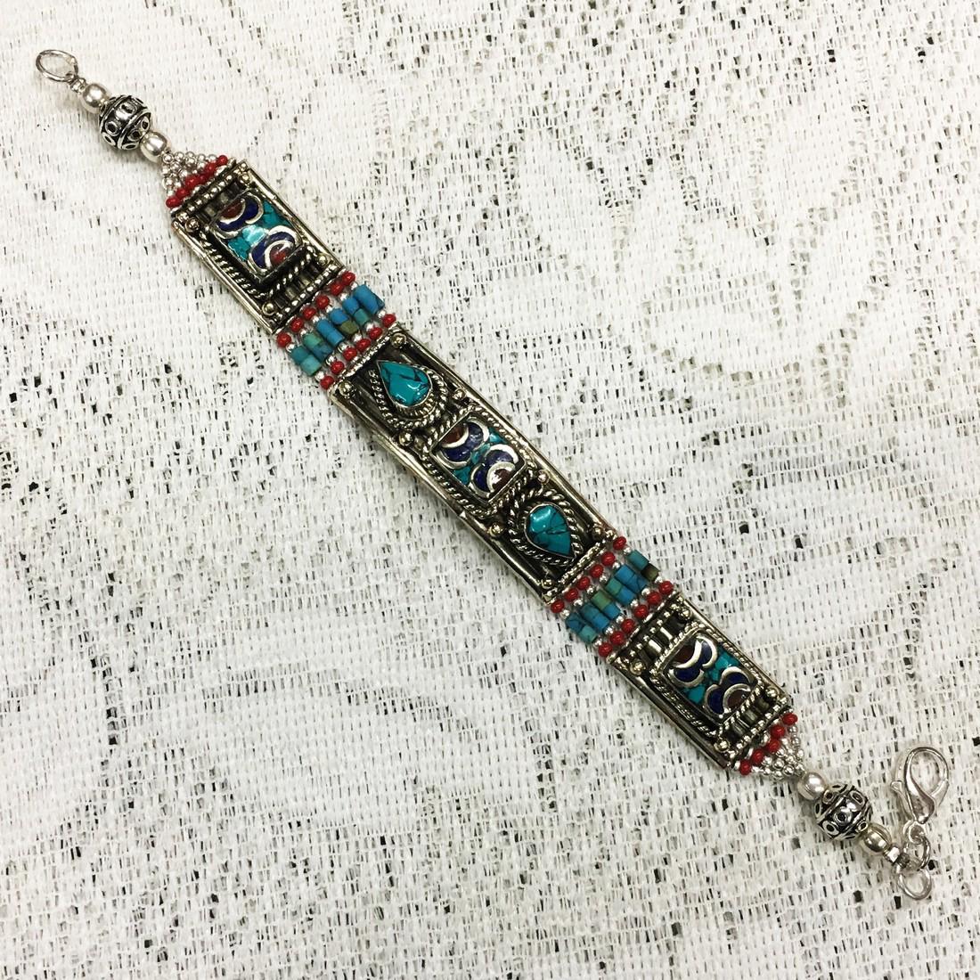Tibetan Silver Turquoise Coral Bracelet: Item: Tibetan & Nepalese Tibetan Silver Tibetan Bracelet Origin: Tibetan Stones: Turquoise & Coral Handmade Size (inches): 6-7 Shipping: Domestic: Flat-rate of $3.00 to anywhere within the contiguous 