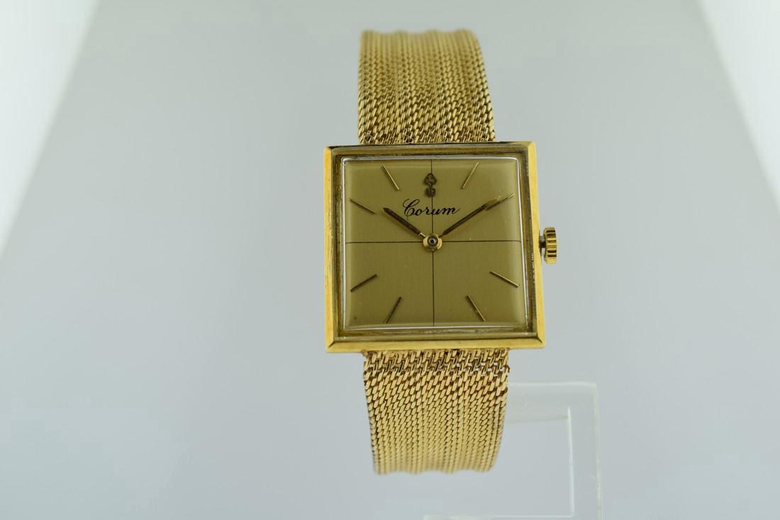 Corum 18K Gold Mechanical Watch, 1970s: Watch: Corum 18K Gold Mechanical Watch Date: 1970's Movement: Mechanical, hand winding Case Metal: 18K gold Case Size: 30mm Strap/Bracelet Type: 14K gold Bracelet Length: 7.25 inches Additional Info: