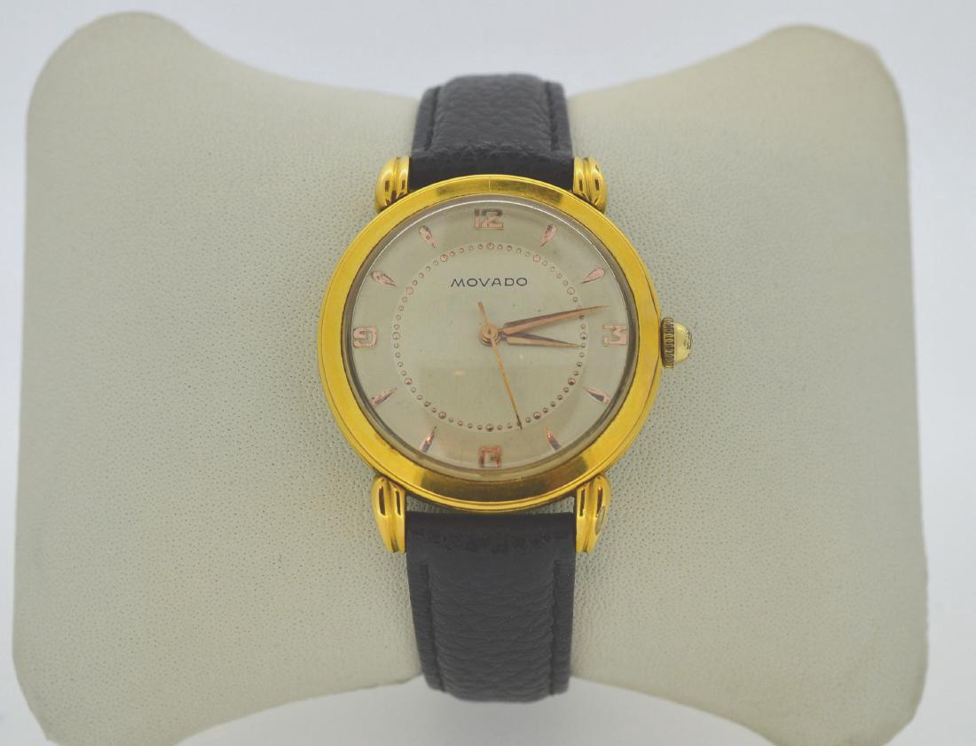 Vintage Movado Gold Tone Steel Men's Wristwatch, 1940s: Item: Men's 33MM Movado Wristwatch Model: Movado Movement: Quartz Case Metal: Gold-plated stainless steel Case Size: 33mm diameter Dial: Arabic Bracelet Length: 9" Vintage 1940's 0r 1950's Self-Windin