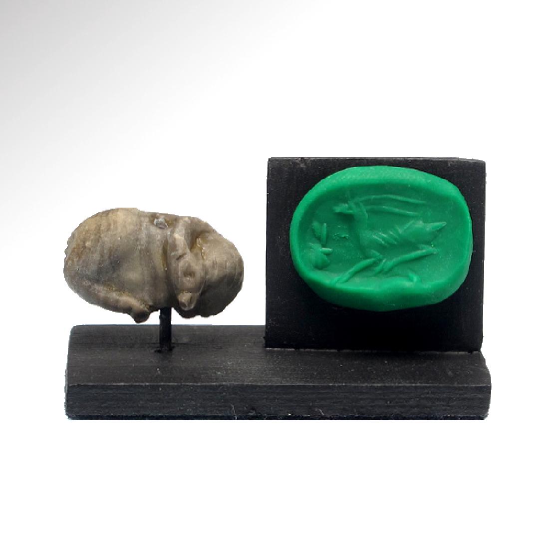 Mesopotamian Seal-Amulet of a Reclining Deer, c. 2200: Mesopotamian Seal-Amulet of a Reclining Deer, c. 2200 -2000 B.C. Origin: Mesopotamia, c. 2200-2000 B.C. Material: Steatite Dimensions: 2.3 cm L - 7/8 inches Provenance: Ex. collection Mr. I. Basan, ac