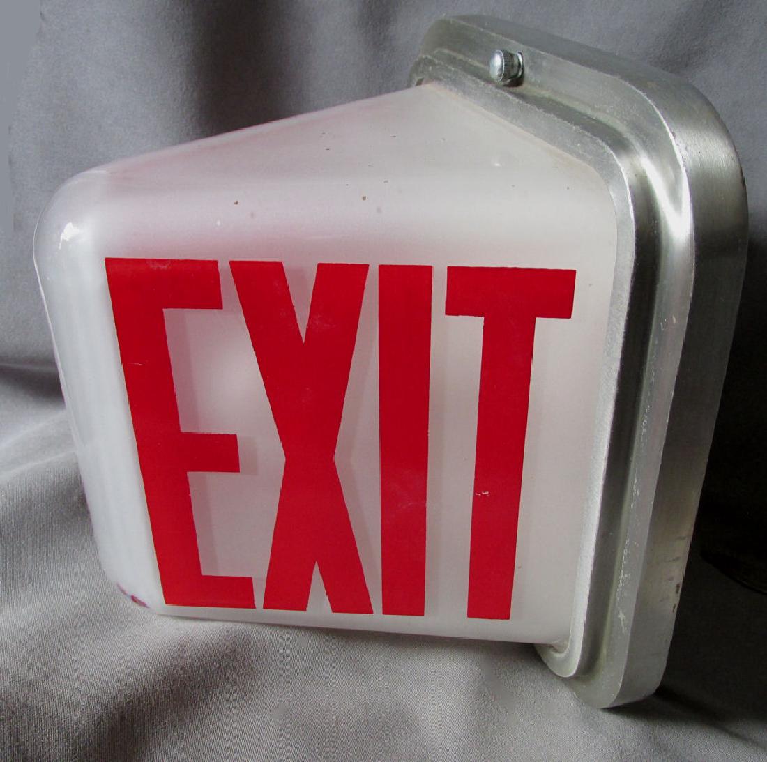 Art Deco 30-40s Glass Perfeclite Illuminated Exit Light: A vintage, retro ( Circa 1930-40s) industrial Exit Light. The interior commercial building exit lamp was designed and fabricated by the Perfeclite Company of Cleveland, Ohio. The glass wedge shaped gl