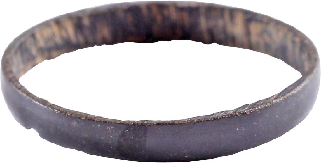 VIKING WOMAN'S WEDDING RING 866-1067 AD: Bronze. Size 7. Narrow rounded band with fine uniform glossy patina. Good representative example. Vikings exchanged rings on the pommel of the groom's sword. No Reserve: This lot starts at 1 and has n