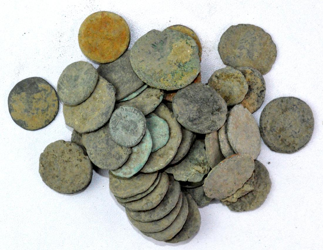 Lot of 50 Roman Coins for Cleaning.: Date: 1st - 4th C AD Material: bronze Provenance: Obtained from an old German collection, acquired in Munich, purchased from a private collector. Dimensions: 14-22mm; 118.7grams Description: Lot of 50