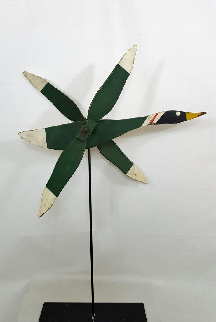 Flying Goose Whirligig Ca 1930's: Flying Goose Whirligig ca 1930's. 22" long. Shipping: Domestic: Flat-rate of $25 to anywhere within the contiguous U.S. International: Foreign shipping rates are determined by destination. Location: T