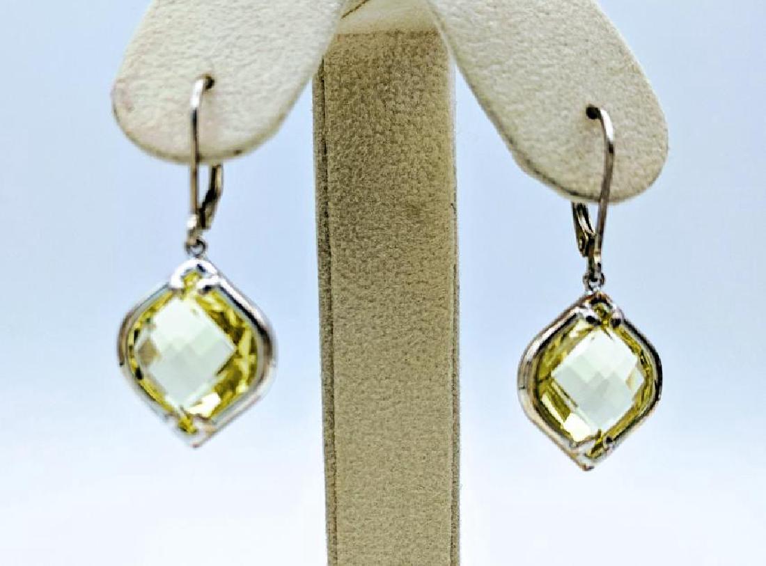 Sterling Silver Dangling Citrine Earrings, 20ctw: Item: Sterling Silver Dangling Citrine Earrings Brand: Jean Lin Collection Metal Purity: 925 Sterling Silver Gemstones: Citrine Each Earing has a Citrine that is 14Ã—13mm each (10ct each). Shipping