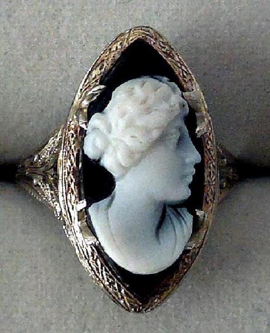 Antique Edwardian 14K White Gold Onyx Cameo Ring: Item: Edwardian 14K Carved Stone Cameo Ring Maker: M & G Origin: Unknown Date/Period: Ca 1890-1910 Materials: Onyx, 14K White Gold Size: 5.5 This romantic antique cameo ring is size 5.5.Â The setti