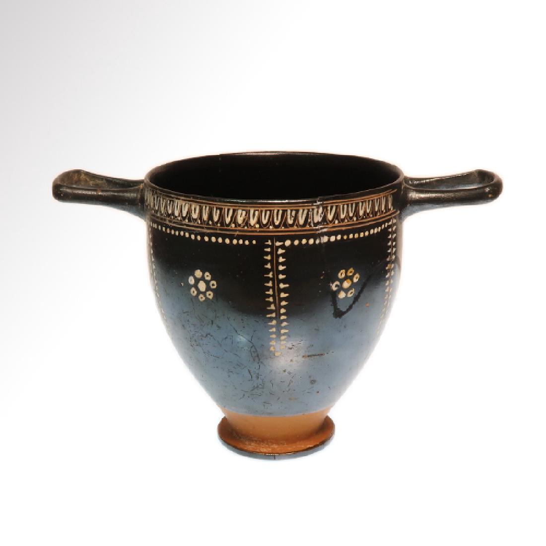 Greek Gnathian Painted Skyphos, c. 340-320 B.C.: Date & Origin: Greek, c. 340-320 B.C. Description: Greek Gnathian skyphos decorated on one side with vines above and around an amphora alabastron, ovolo and scrolls bands around the top. Horizontal ha
