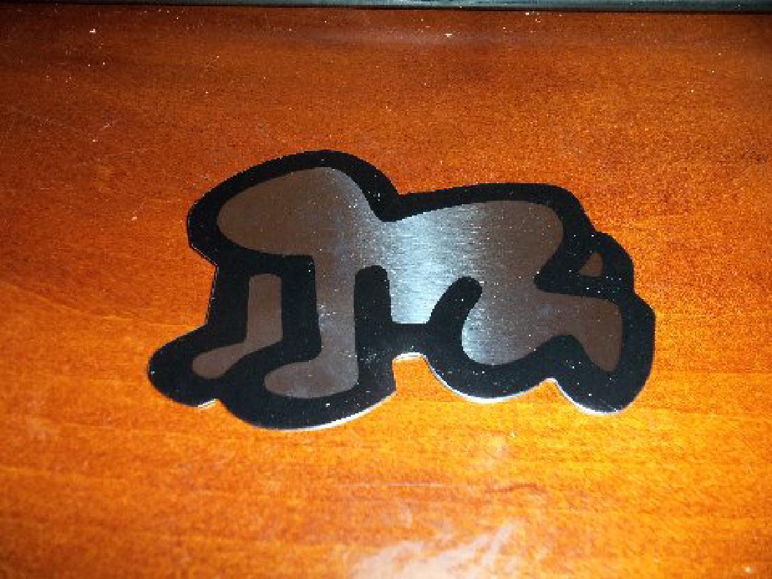 Keith Haring Pop Shop Radiant Baby: Keith Haring Pop Shop "Radiant Baby" silver mirror finish Decoration artist signed & dated 1989 Size: Measures 4 1/2" long x 3 1/2" tall and has a hook on the back Keith Haring Pop Shop " Radiant Baby