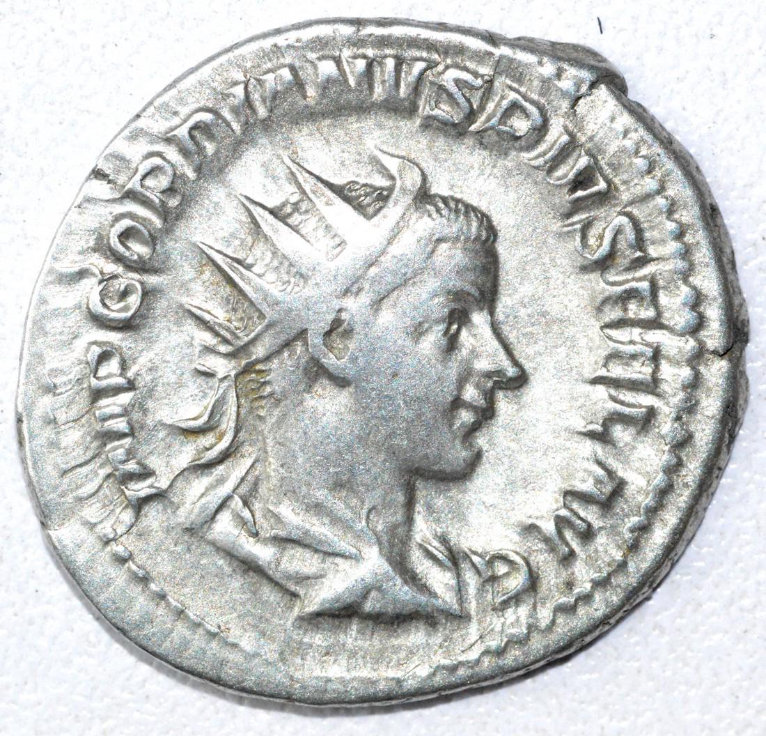 Ancient Roman Antoninianus Coin - Gordian III: Date: 3rd C AD Material: Silver Provenance: Obtained from an old British collection, acquired from B.C.F. (Birmingham). Dimensions: 25mm; 4.5grams Ancient Roman Antoninianus Coin - Gordian III AR rv. 