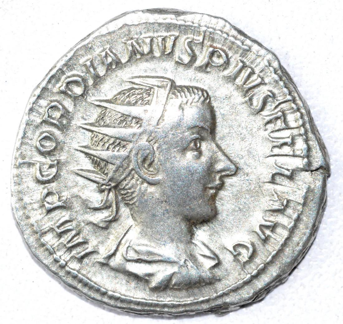 Ancient Roman Antoninianus Coin - Gordian III: Date: 3rd C AD Material: Silver Provenance: Obtained from an old British collection, acquired from B.C.F. (Birmingham). Dimensions: 23mm; 4.9grams Ancient Roman Antoninianus Coin - Gordian III AR rv. 