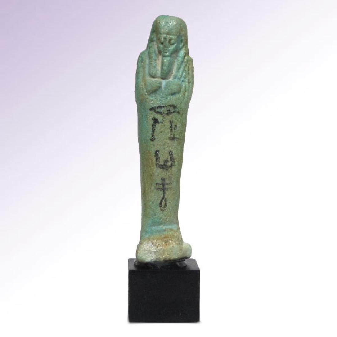 Egyptian Inscribed Faience Shabti of KA NEFER, c.: Date & Origin: Egypt, c. 600-300 B.C. Material: Faience Dimension: 8.8 cm H - 3 1/2 inches Provenance: Old English private collection.ex. Bonham’s auctions London, Oct. 2011 Of turquoise colour faie