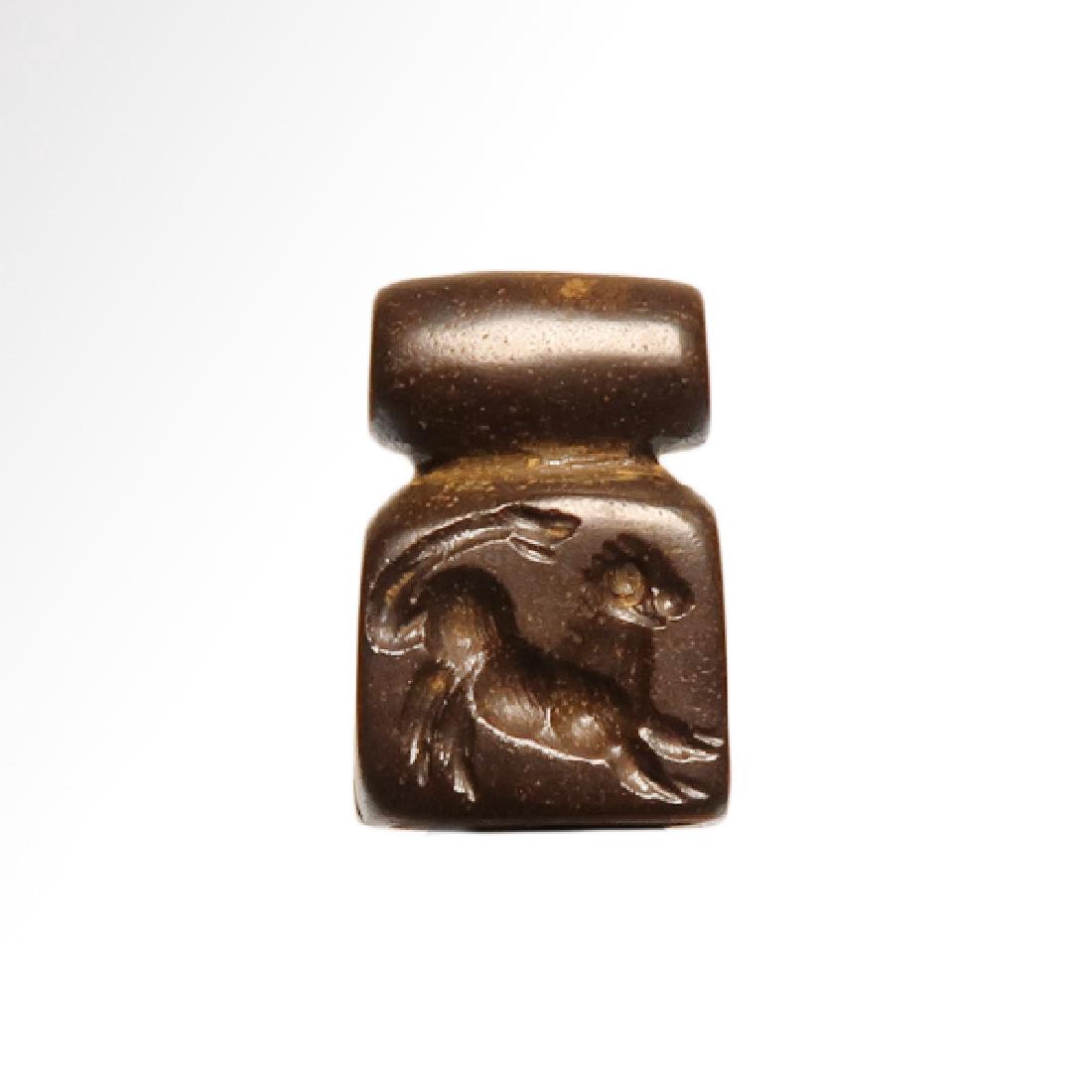 Bactrian Hematite Multi Facet Seal, c. Mid 1st: Date & Origin: Bactrian, c. Mid 1st Millennium B.C. Material: Hematite Dimension: 2.4 cm L - 1 inch (including loop) Provenance: ex. Collection A S S, London UK Of cubic form, engraved on five sides w