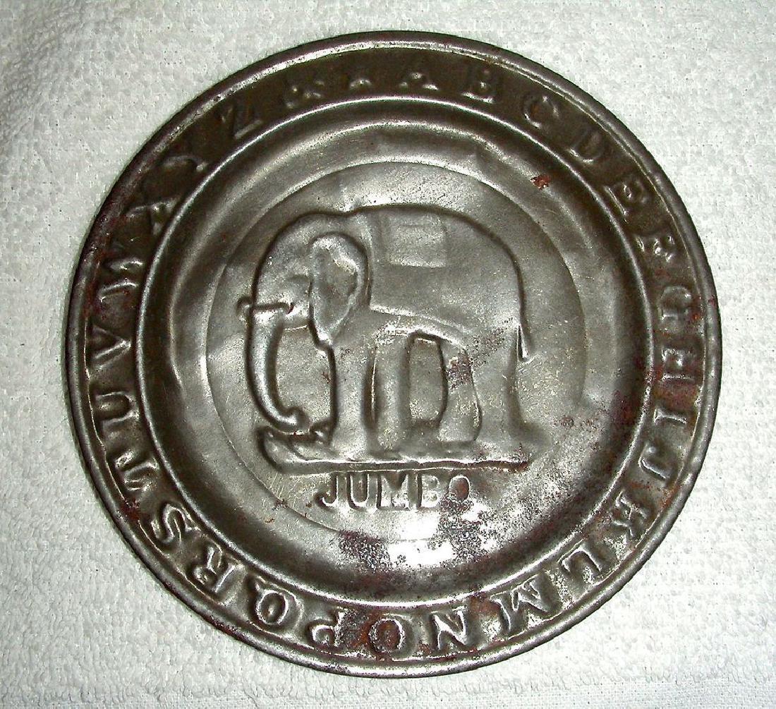 Child’s Tin ABC Alphabet Plate Jumbo the Elephant 1880: A very nice child’s tin ABC Plate w/ an embossed image of Jumbo the Elephant in the center. The plate dates c. 1880 (Jumbo died in 1885 in a train accident in Ontario, in case you ever plan to appea