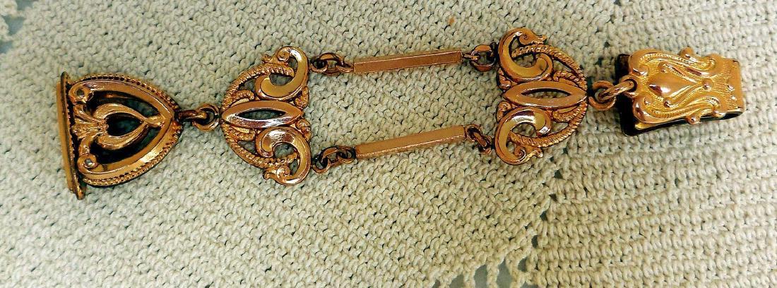 Edwardian Gold-Filled Watch Fob: Item: Edwardian Gold-Filled Watch Fob Maker: Unknown Origin: Unknown Date/Period: Late 19th, Early 20th Century Materials: Gold-Filled Metal Size: 4 1/4 Inches Long This is a beautifully formed watch 