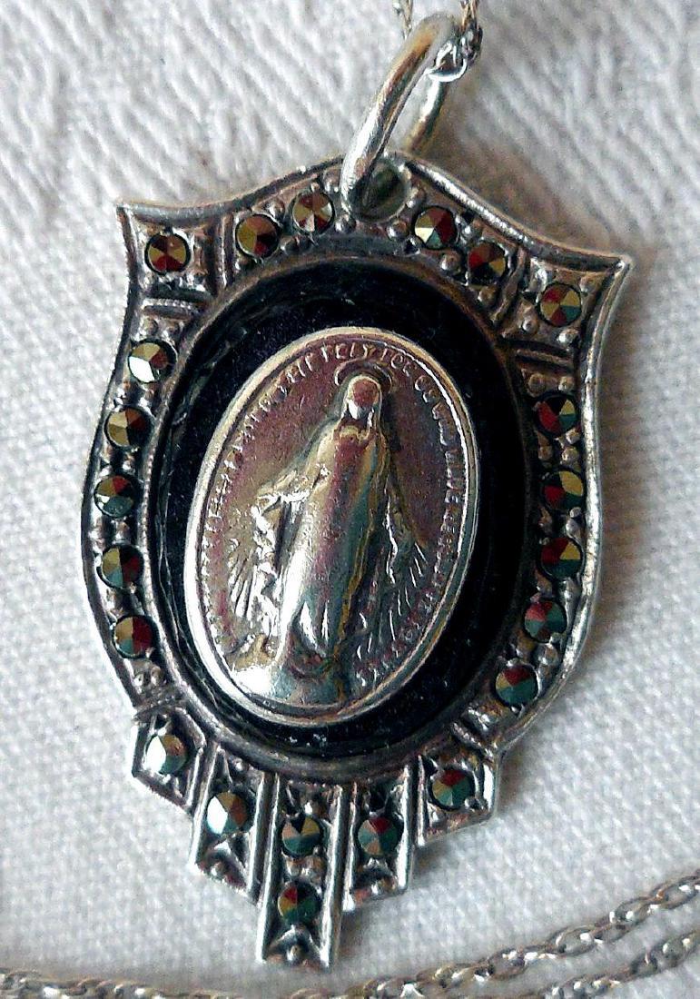 Sterling Silver Madonna, Onyx, Marcasite Pendant: Item: Sterling Silver Madonna, Onyx, Marcasite Pendant Maker: I and H Origin: USA, Date/Period: Early to mid-20th Century Materials: Sterling, Marcasites, Onyx Size: Pendant 1 Inch long, Chain 18 Inch