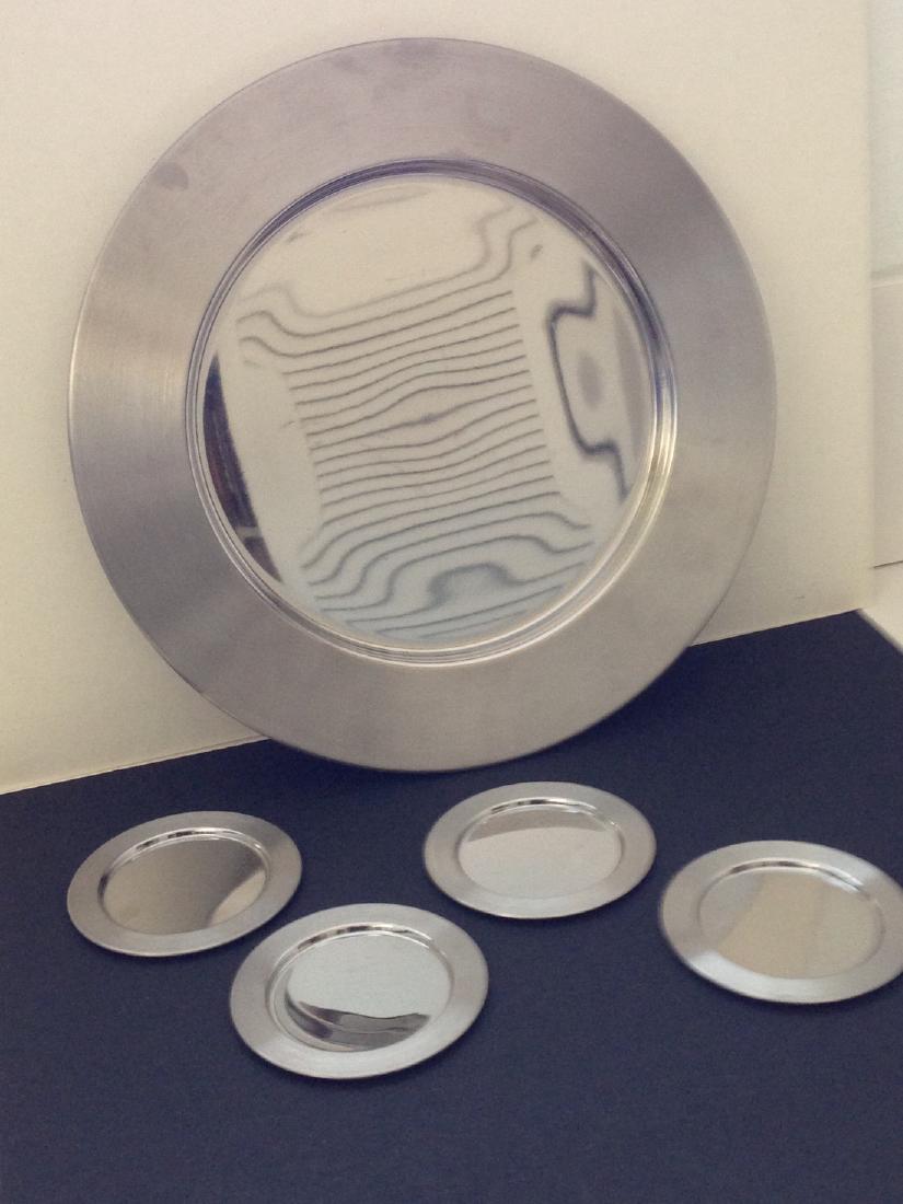 Timo Sarpaneva Bar serving set: 12 1/2 " Chrome platter with 4 4" coasters - etched Sarpaneva Design Finland Please note that this lot has a confidential reserve. When you leave a bid in advance of the auction, submit your maximum.
