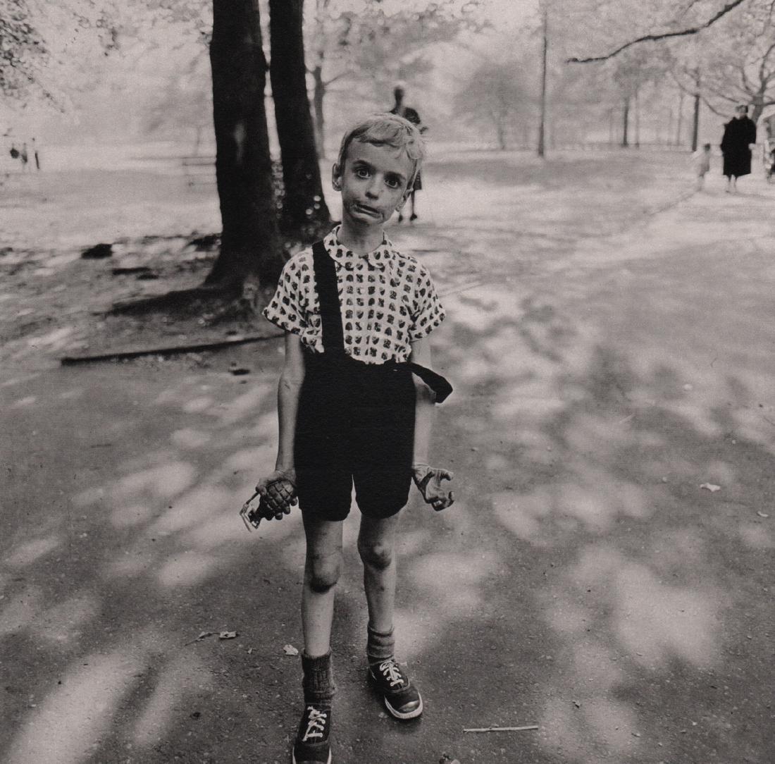 DIANE ARBUS - Child with toy Hand Grenade: Artist: DIANE ARBUS Print Title: Child with toy Hand Grenade in Central Park NY 1962 Medium: Sheet-Fed Gravure Printed in 1979 Printed in Italy Image Size: 9.75 x 9.75 inches Diane Arbus was an Americ