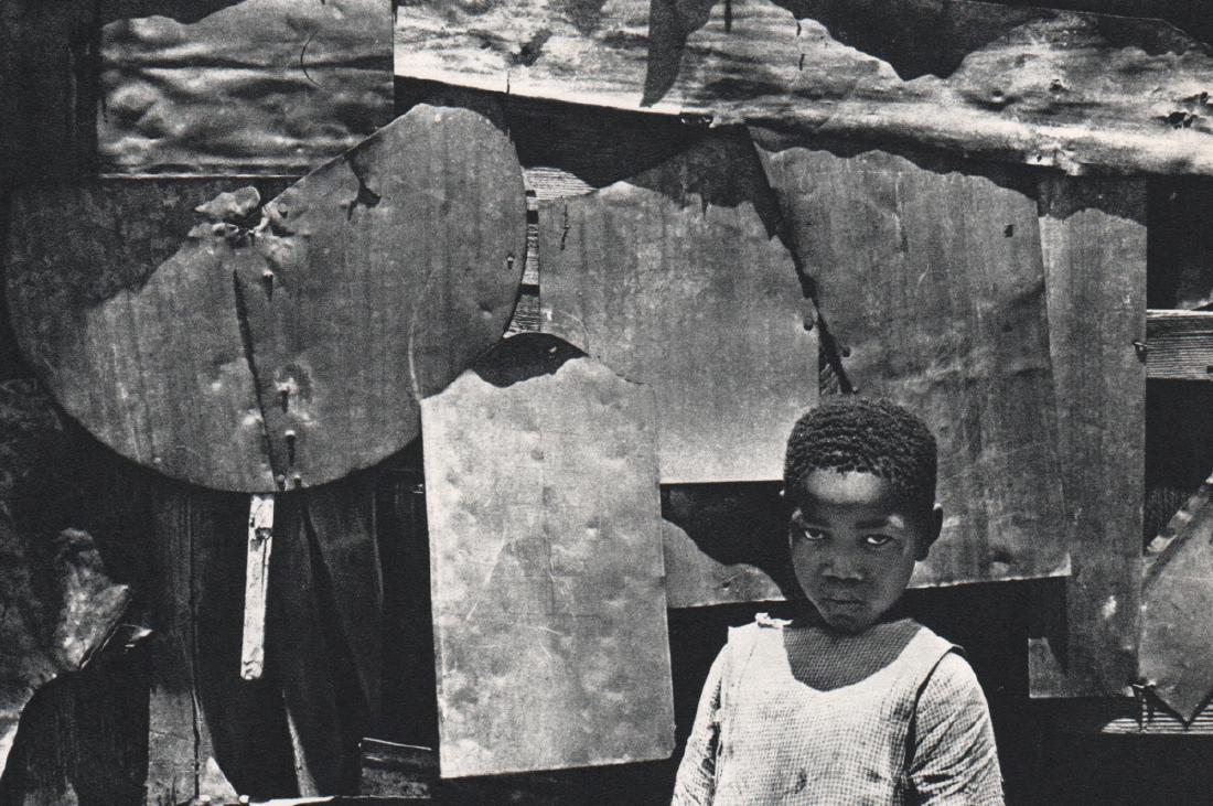 DAN WEINER - Shanty Child, Sophiatown South Africa 1954: Artist: DAN WEINER Print Title: Shanty Child, Sophiatown South Africa 1954 Medium: Sheet-fed Gravure Printing Date: 1968 Printing Location: Holland Image Size: 7 x 5 inches Dan Weiner1919–1959) was