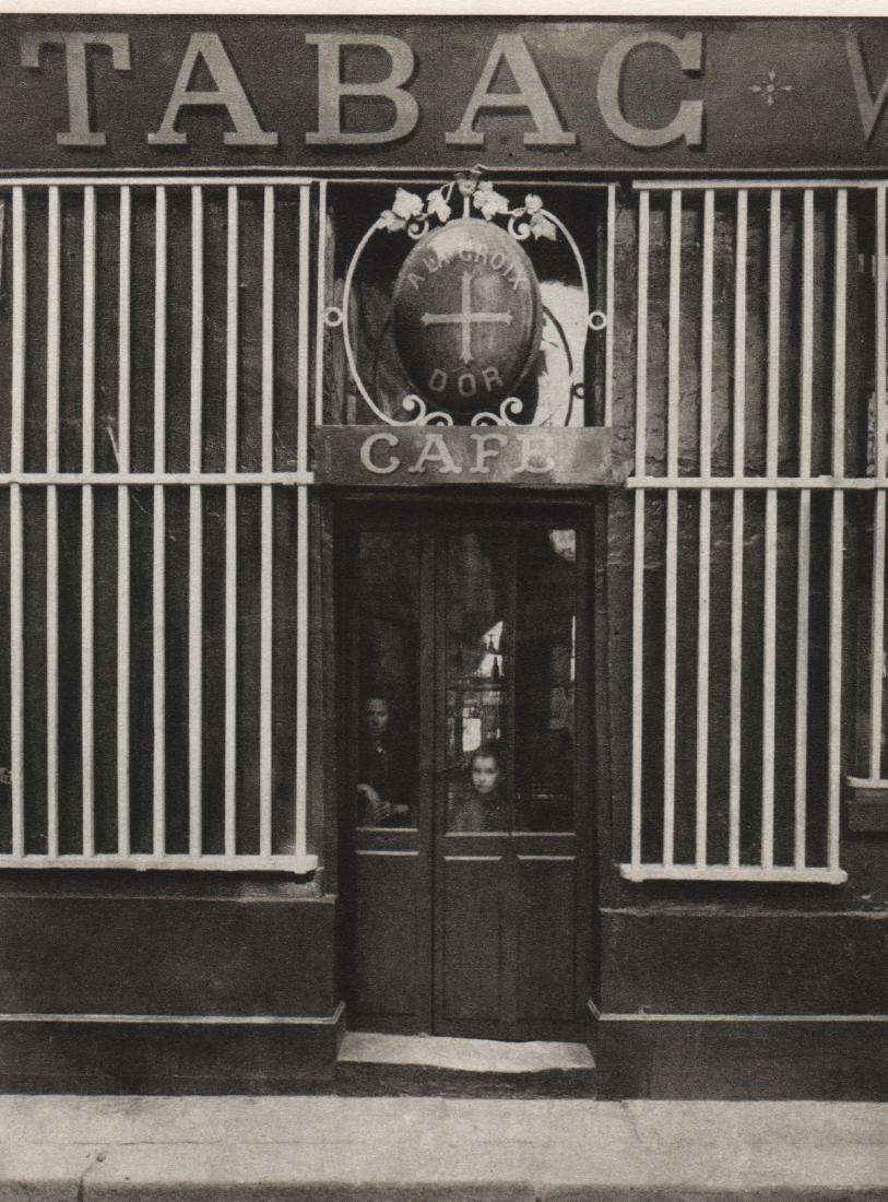 EUGENE ATGET - Wine Merchant Store Front: Artist: EUGENE ATGET Print Title: Wine Merchant Store Front Medium: Sheet-Fed Gravure Printed in 1965 Printed in France Image Size: 4.5 x 6 inches Eugene Atget(1857-1927) was a pioneer of documentary