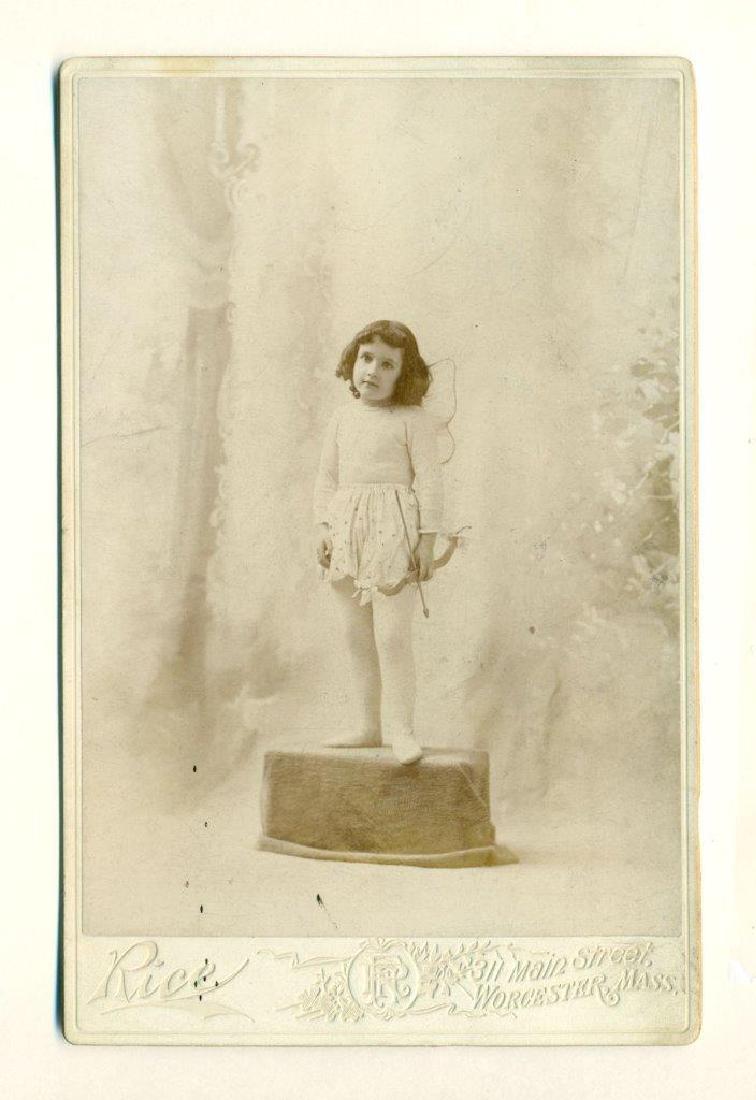 1880 Sweet Little Girl in Cupid Costume Wings: Circa 1880s Cabinet Card Photograph; Depiction of a sweet little girl dressed as cupid, with wings and holding a bow and arrow. Photograph is by Rice of Worcester, Massachusetts. Nice photographer's a