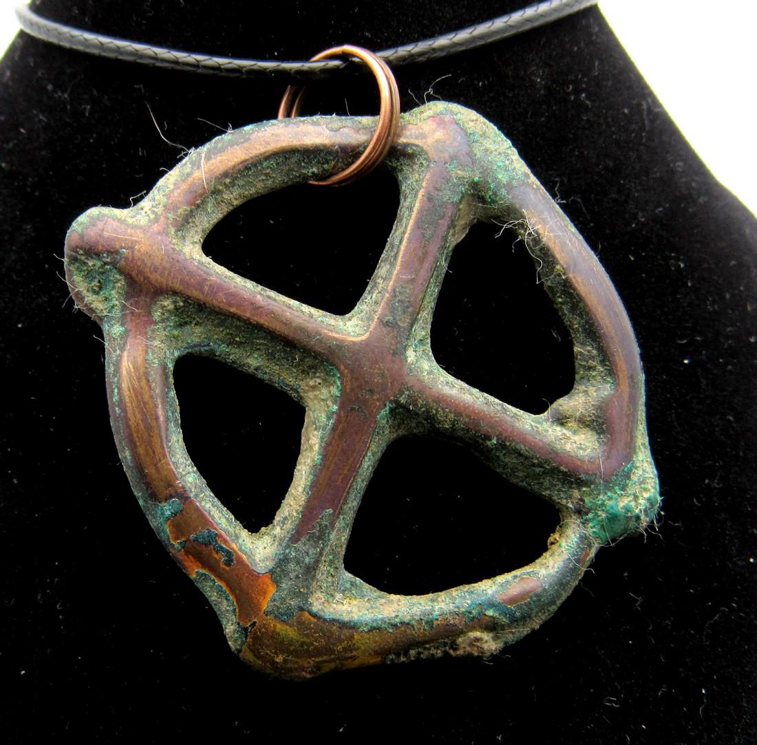 Roman Wheel of Fortune Pendant: Date: ca. 100 - 300 AD Material: Bronze Provenance: Obtained from an old British collection, purchased from a private collector in London, acquired between 1960 - 1990. Dimensions: 45mm; 17.6grams Rom