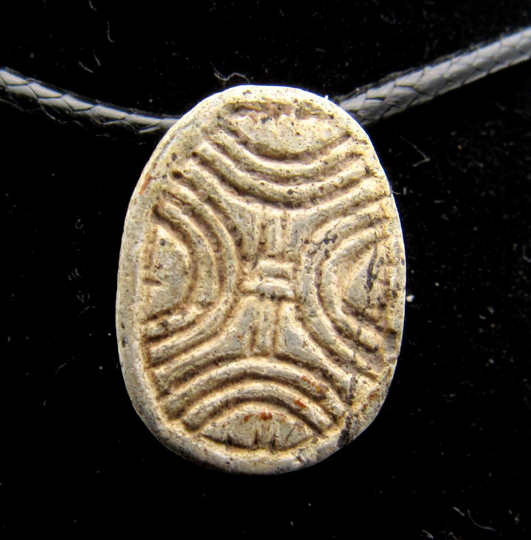 Ancient Egyptian Scarab with Hieroglyphs: Date: ca. 1500 BC Material: Stone Provenance: Obtained from an old British collection, purchased from a gentleman in London. Dimensions: 15mm: 1.4grams Ancient Egyptian Scarab with Hieroglyphs, Expert