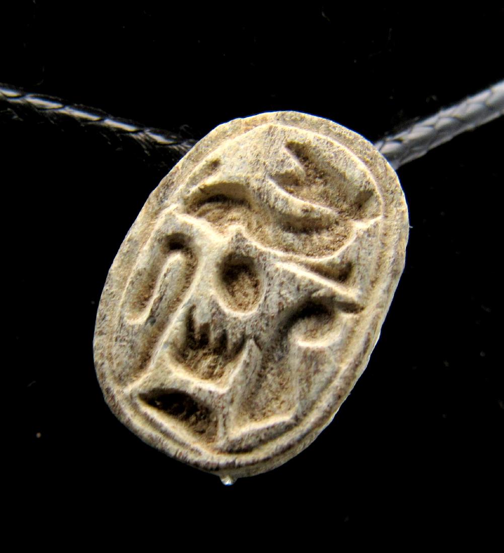 Ancient Egyptian Scarab with Hieroglyphs: Date: ca. 1500 BC Material: Stone Provenance: Obtained from an old British collection, purchased from a gentleman in London. Dimensions: 14mm: 1.4grams Ancient Egyptian Scarab with Hieroglyphs No Rese