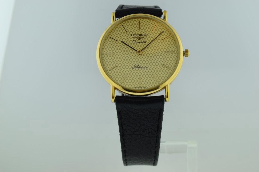 Longines Quartz Presence Gold Plate Watch, 1980s: Watch: Longines Quartz Presence Gold Plate Watch Date: 1980's Movement: Quartz, battery operated Case Metal: Gold plated case, stainless steel back Case Size: 34mm Strap/Bracelet Type: Original strap