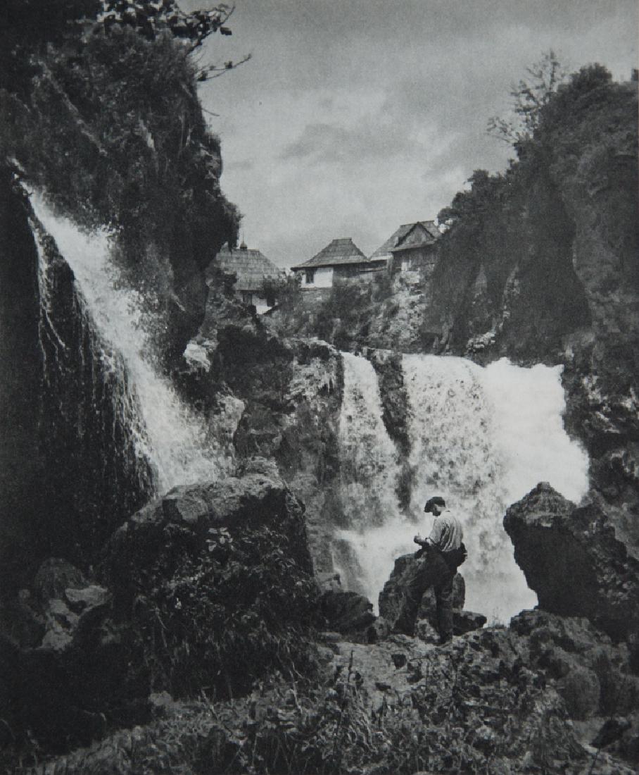 MARTIN HURLIMANN - "Waterfalls in Jajce, Bosnia": Artist: MARTIN HURLIMANN Title: "Waterfalls in Jajce, Bosnia" Medium: 1957 Sheet Fed Gravure, printed in Zurich Dimensions: 8x9.5" Mounted on 14x18" acid free conservation board Comes with COA Martin 