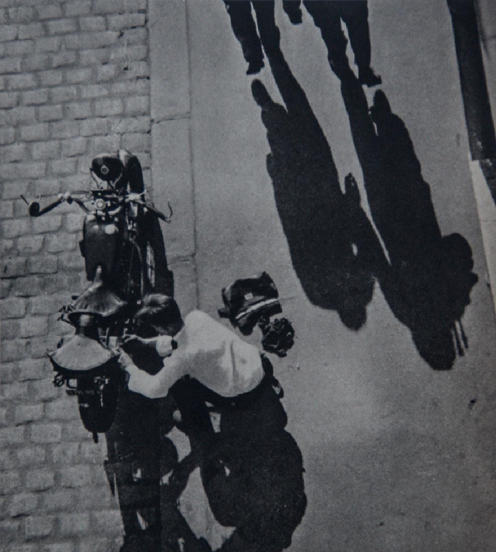 ANDRE KERTESZ - Shadows and Motorcycle: Artist: ANDRE KERTESZ Title: Shadows and Motorcycle Medium: 1935 Sheet Fed Gravure, printed in Great Britain. Dimensions: 6.75x7.5" Mounted on 11x14" Conservation Quality Board With COA Andre Kertesz,