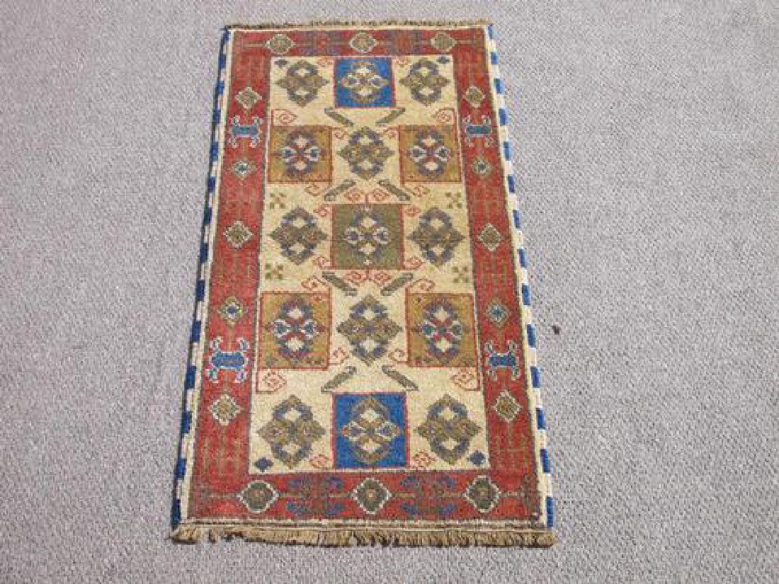 Handmade Kazak Design Rug 2.2x4.2: Rug: Hand Woven Kazak Design; Material: Fine quality wool pile, all natural vegetable dye; Size: 2.2 X 4.2 feet; Foundation: Cotton; Design: Kazak; Origin: Nepal; Please note that this lot has a confi