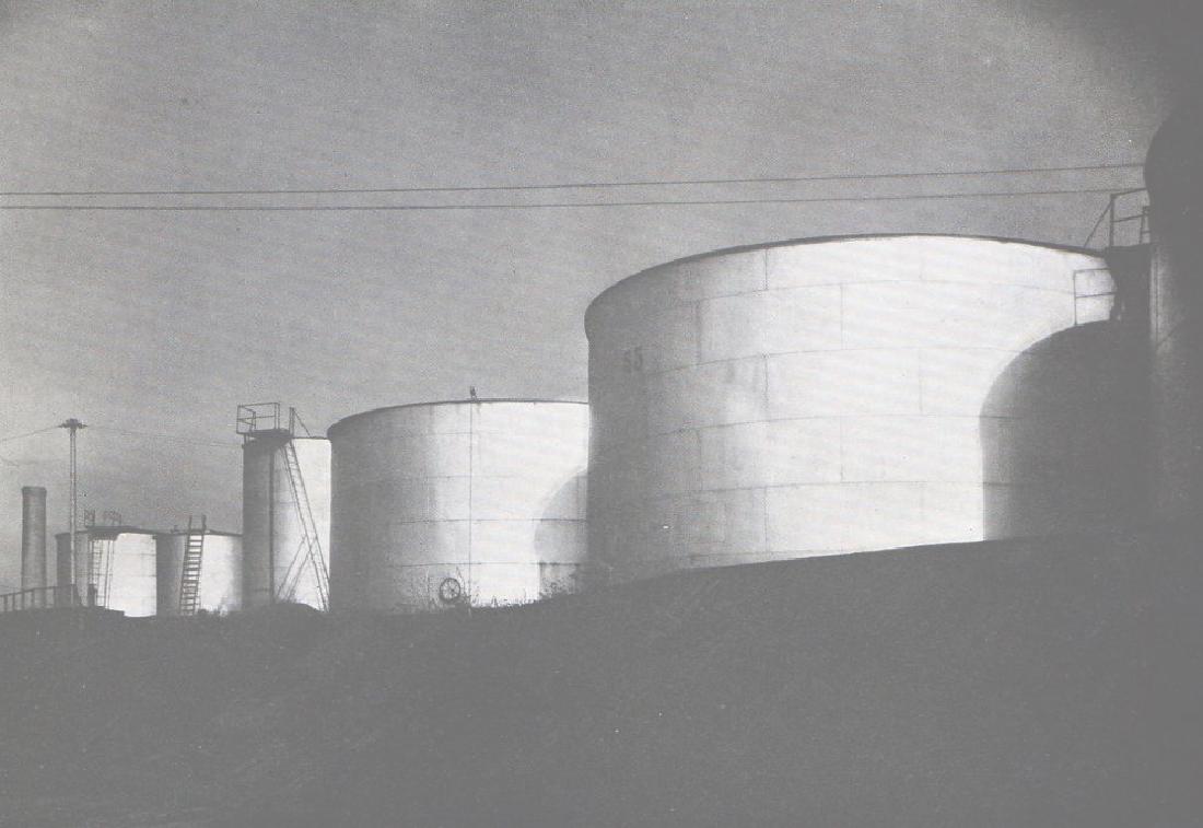 MARGARET BOURKE-WHITE - Oil Tanks: Artist: MARGARET BOURKE-WHITE Print Title: Oil Tanks Printing Date: 1933 Medium: Photoengraving Printed in: the UK Image Size: approx. 5” x 7” No Reserve: This lot starts at $1 and has no reserve