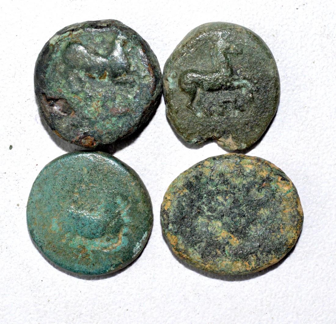 Lot of 4 Ancient Greek Coins for Cleaning: Date: ca. 4th - 2nd C BC Material: Copper / Bronze Origin: From an old British collectom, acquired on German and Austrian art markets. Dimensions: 14-17mm; 14.6grams Lot of 4 Ancient Greek Coins for C