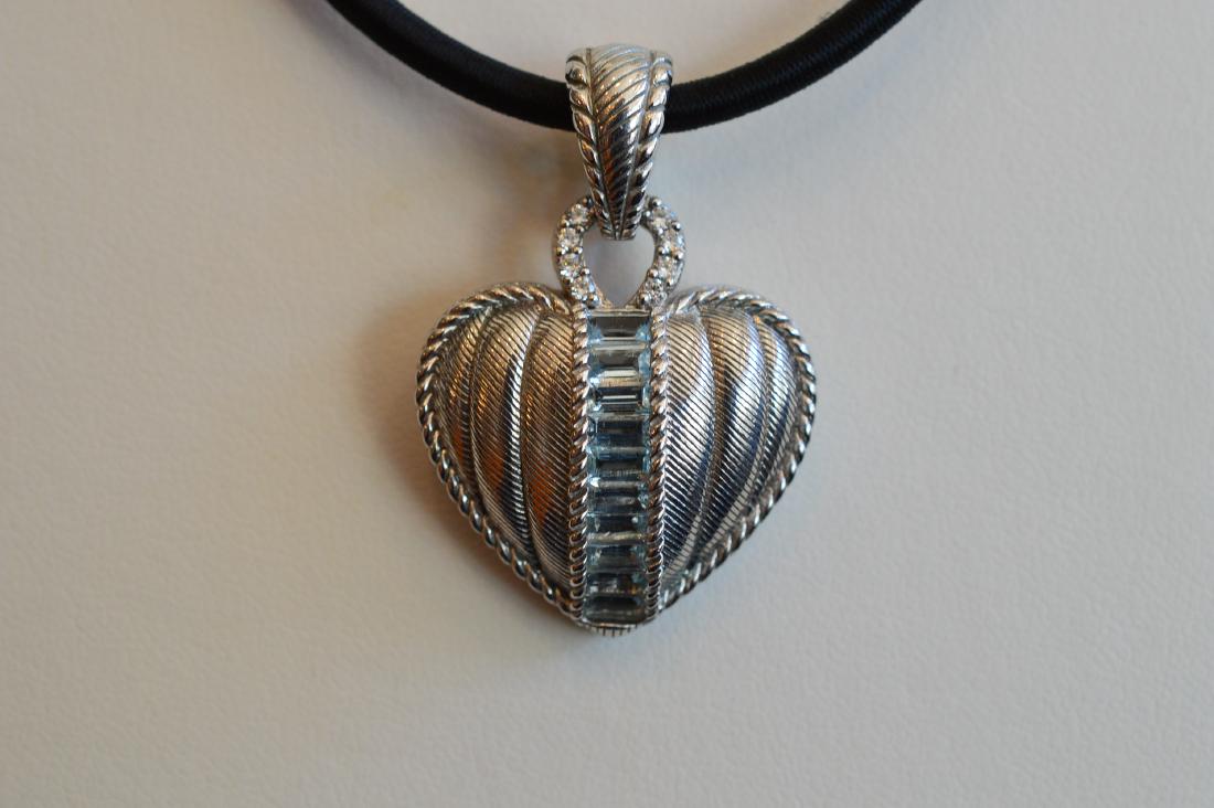 Judith Ripka Sterling Silver Aquamarine Heart Pendant: Item: Ladies Judith Ripka Sterling Silver Heart Enhancer with Aquamarine Brand: Judith Ripka Metal Purity: .925 sterling silver Gemstones: Aquamarine Carat Weights: N/A Size: 26mm wide x 36mm long Mad