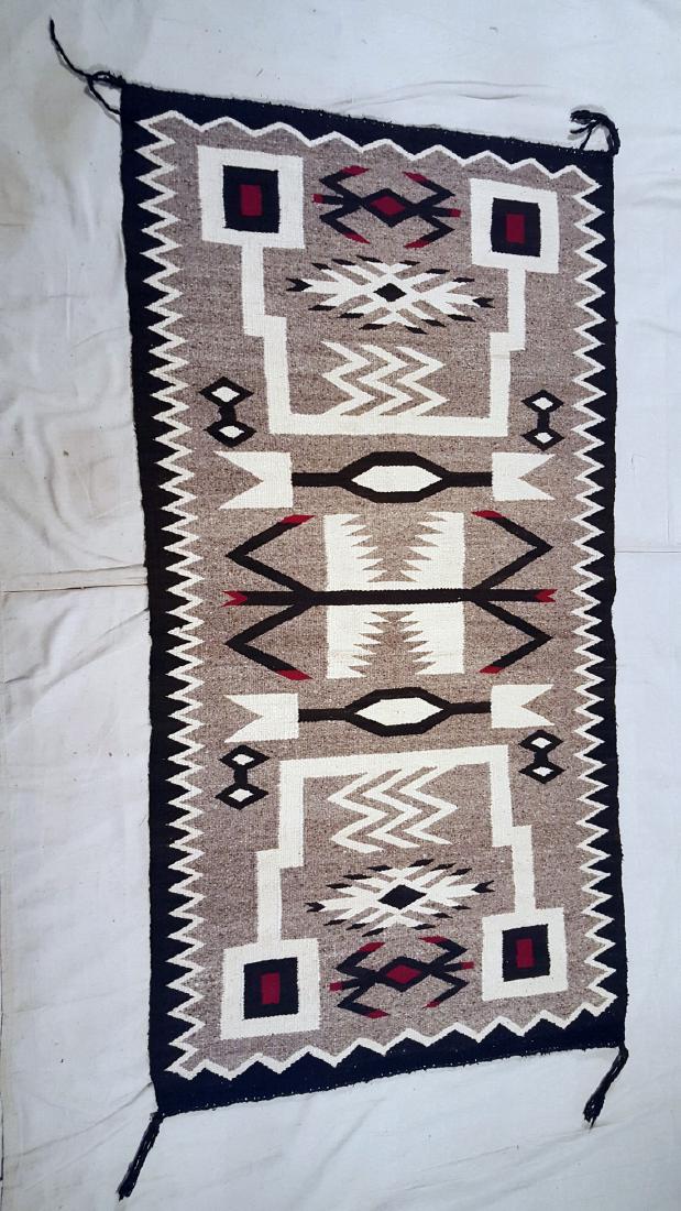 Navajo Storm Pattern Variation Pictorial Rug 1950's: Navajo storm pattern variation pictorial rug ca 1950's 64" x 33". Please note that this lot has a confidential reserve. When you leave a bid in advance of the auction, submit your maximum. The bidde