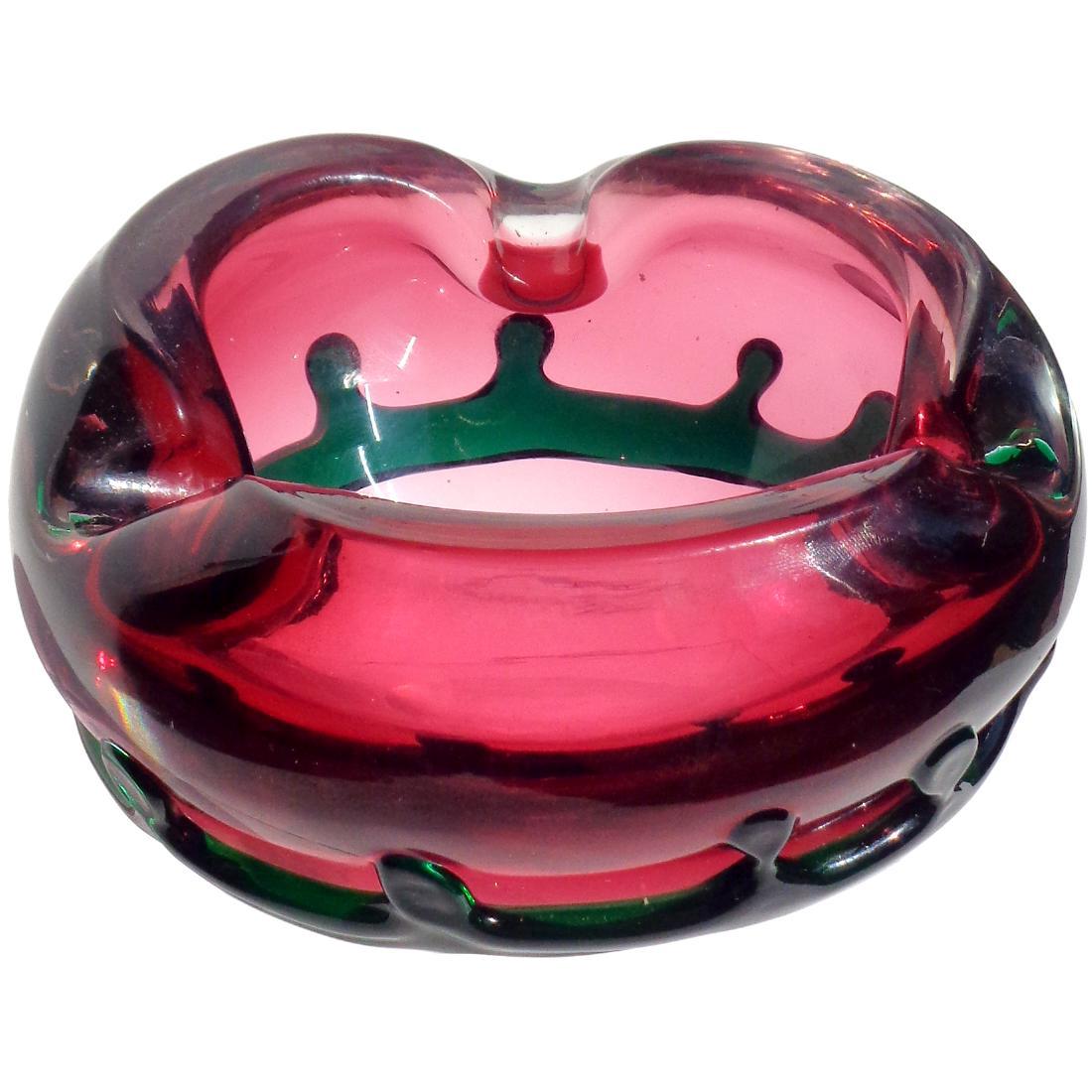 Fratelli Toso Sommerso Pink Green Crown Art Glass Bowl: Murano hand blown pink with applied green crown decoration art glass bowl / ashtray. Documented to the Fratelli Toso company. Measures 6" across x 3 3/4" tall. Please note that this lot has a confiden