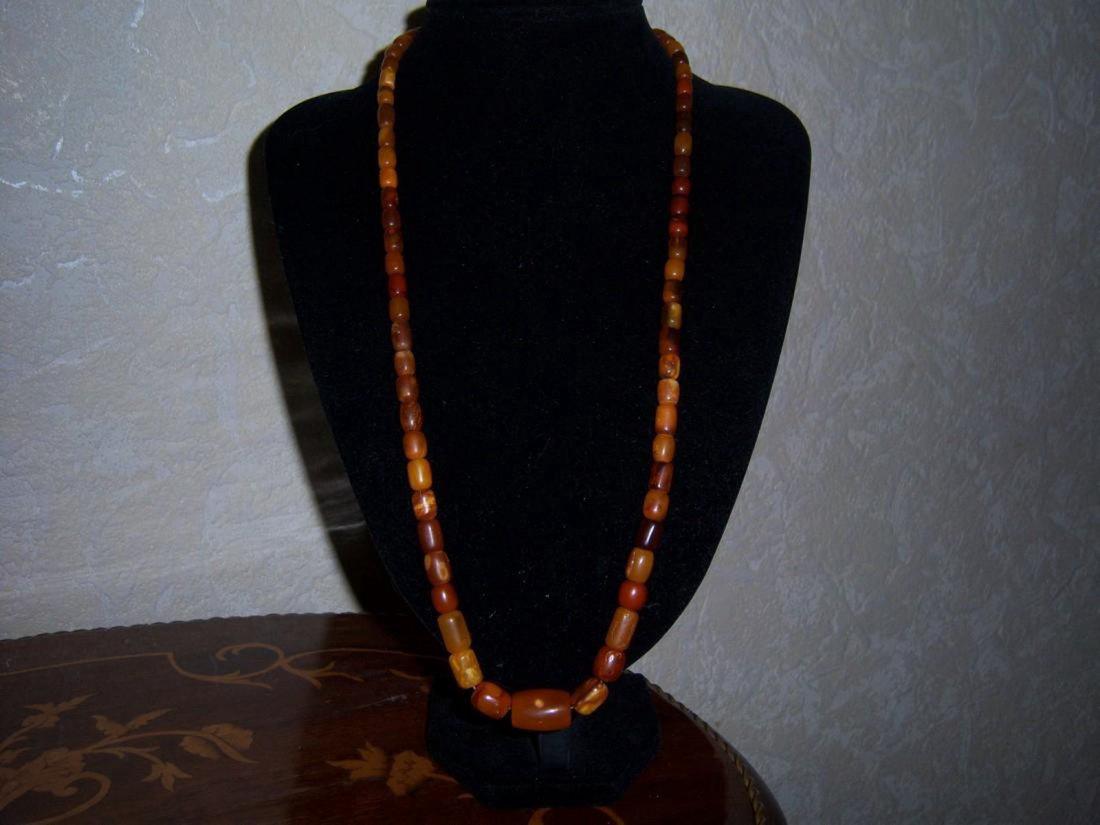 Vintage Butterscotch Amber Necklace: Antique Vintage Very Old Butterscotch Amber 25 Gr , Length 63 Cm ; Largest beads 21 mm x 13 mm , smalest beads 7 mm x 6 mm ;Signature Please note that this lot has a confidential reserve. When you lea