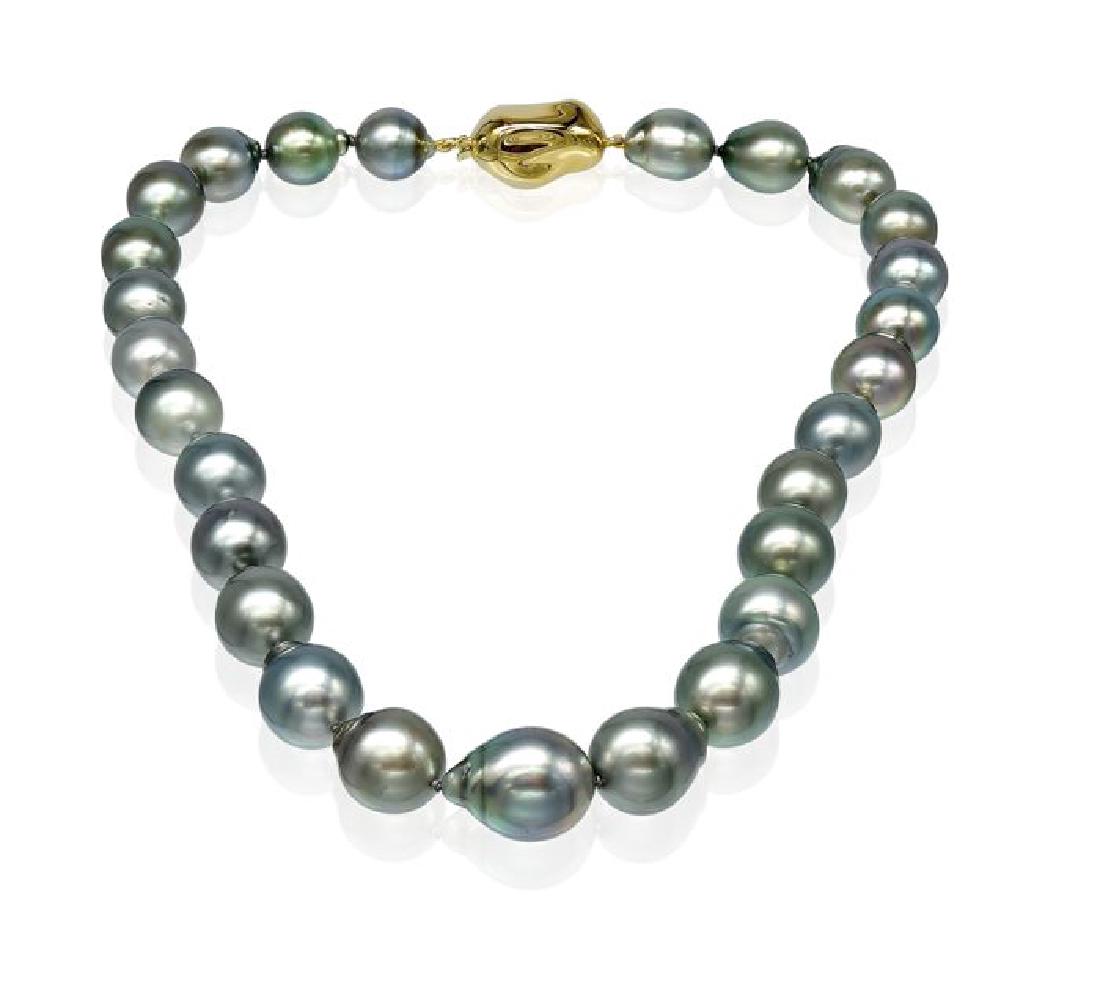 Lustrous Baroque Tahitian Pearl Necklace: Lustrous Baroque Tahitian Pearl Necklace Featuring a Yellow Baroque Shaped Clasp - Authenticity Certificate Included. Emerging from the tropical lagoons of French Polynesia, these Tahitian pearls have