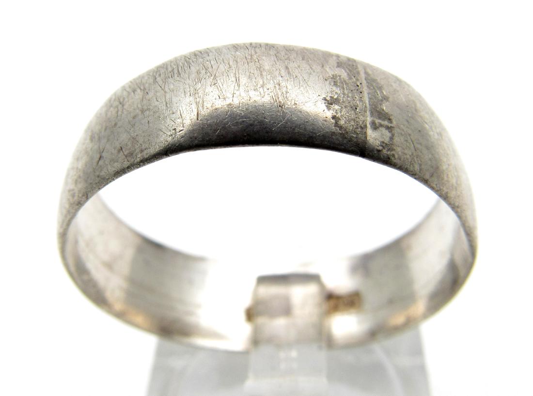 Antique Hallmarked Silver Wedding Band: Date: 17th - 19th C. AD Material: silver Provenance: Obtained from an old British collection, acquired from the B.C.F. (Birmingham) Dimensions: 21mm; 3.5grams Antique Hallmarked Silver Wedding Band. P